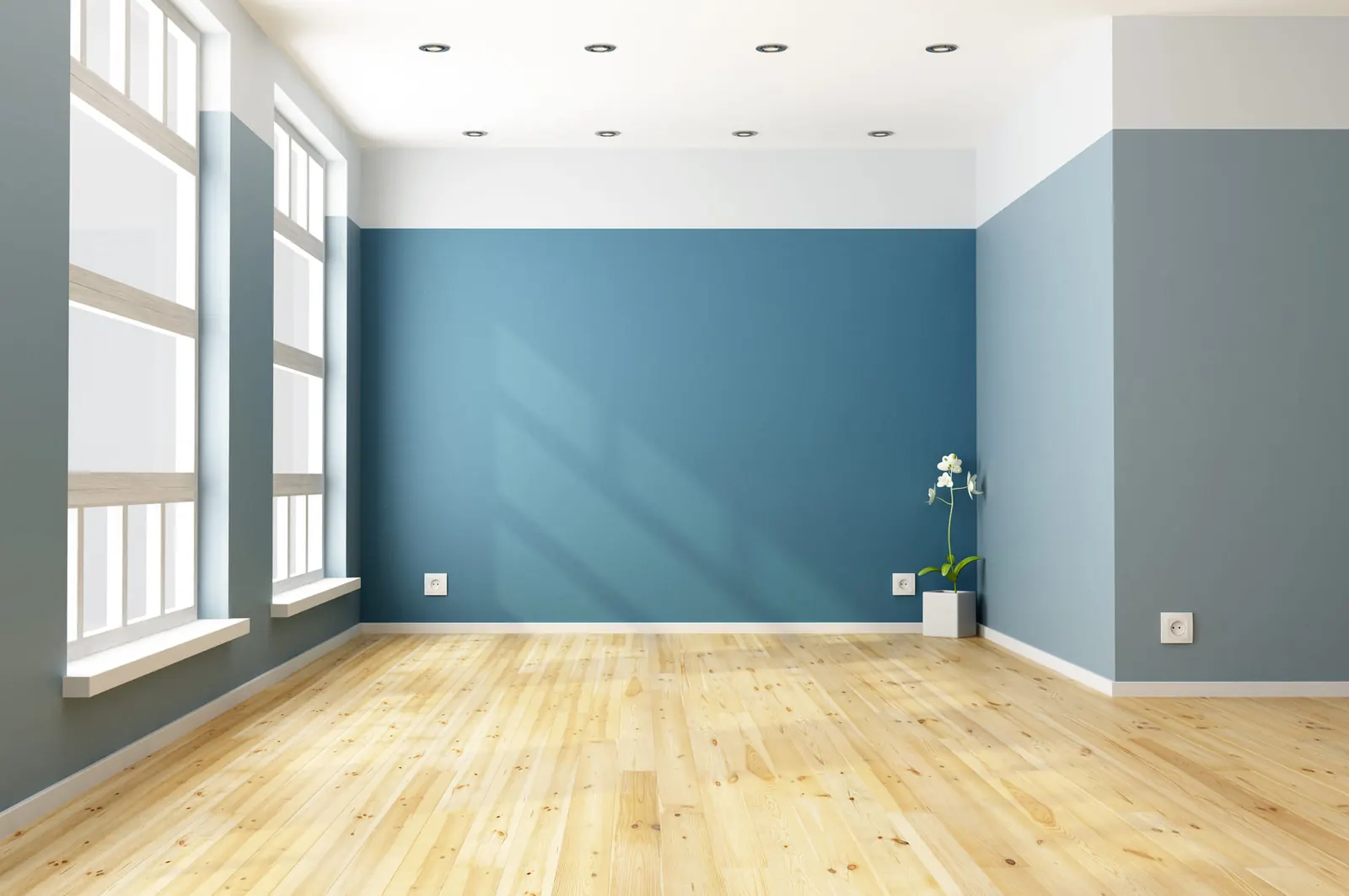Intérieur rénové aux murs bleus et parquet clair